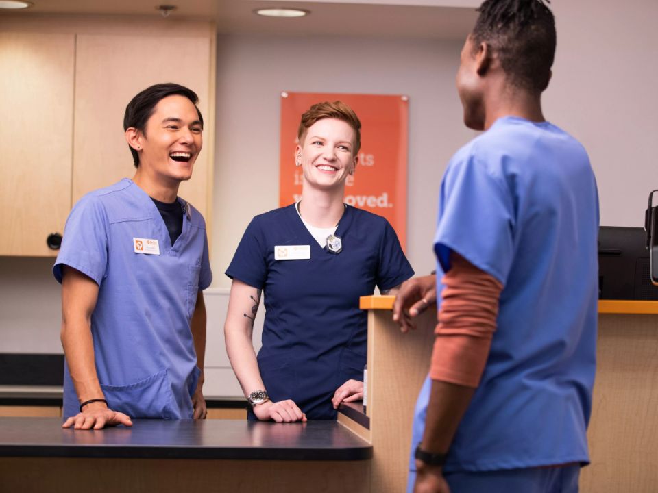 three-smiling-veterinarians-talk